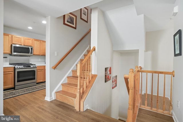 12941 Bridger Dr Unit 1611, Germantown, MD 20874 - stairs with wood finished floors and recessed lighting