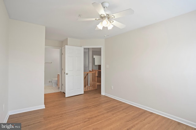 12941 Bridger Dr Unit 1611, Germantown, MD 20874 - unfurnished bedroom with light wood-style flooring, ensuite bath, and ceiling fan