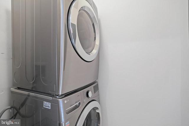 12941 Bridger Dr Unit 1611, Germantown, MD 20874 - laundry room featuring estacked washer and dryer