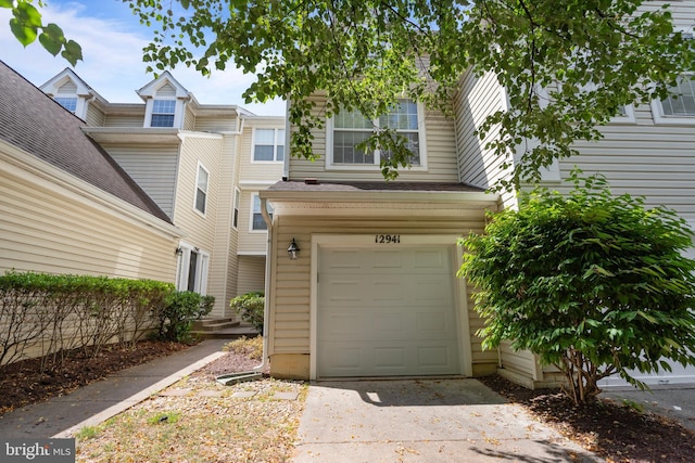 12941 Bridger Dr Unit 1611, Germantown, MD 20874 - view of front of house with an attached garage and driveway