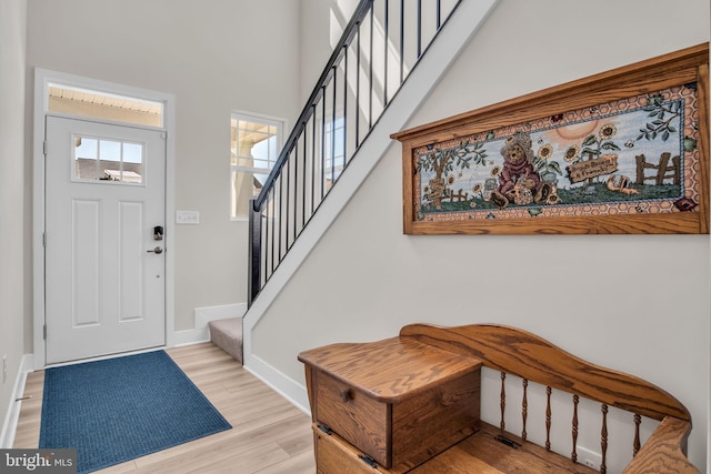 43 Boneset Dr, Gettysburg, PA 17325 - foyer entrance featuring stairs, light wood-style flooring, and a high ceiling