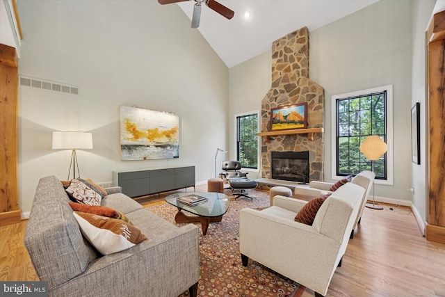 150 Waterview Dr, Glenmoore, PA 19343 - living area with high vaulted ceiling, healthy amount of natural light, wood finished floors, a fireplace, and a ceiling fan