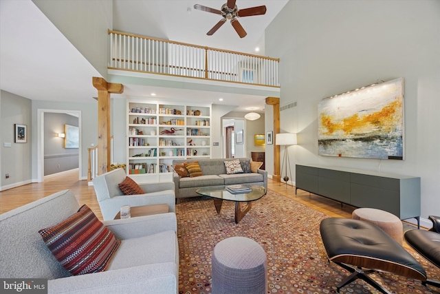 150 Waterview Dr, Glenmoore, PA 19343 - living room with ceiling fan, light wood-type flooring, and a towering ceiling