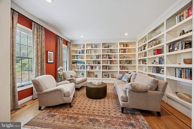 150 Waterview Dr, Glenmoore, PA 19343 - living area with wood finished floors, ornamental molding, recessed lighting, wall of books, and built in features