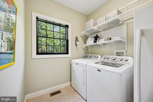 150 Waterview Dr, Glenmoore, PA 19343 - washroom with washer and dryer and light tile patterned flooring