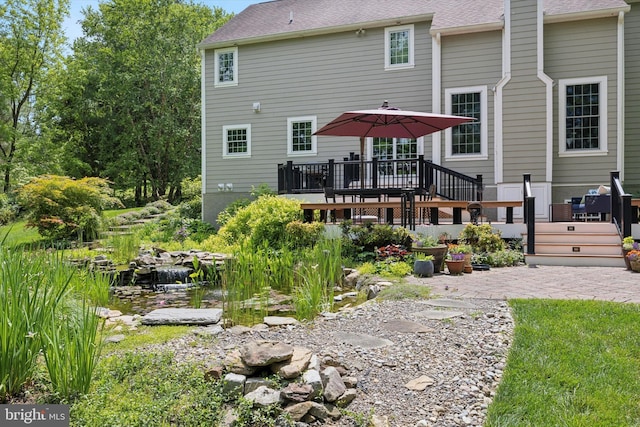 150 Waterview Dr, Glenmoore, PA 19343 - rear view of property featuring a deck, a patio, and roof with shingles