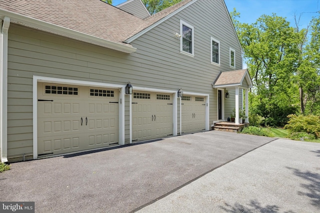 150 Waterview Dr, Glenmoore, PA 19343 - view of property exterior with roof with shingles, asphalt driveway, and an attached garage
