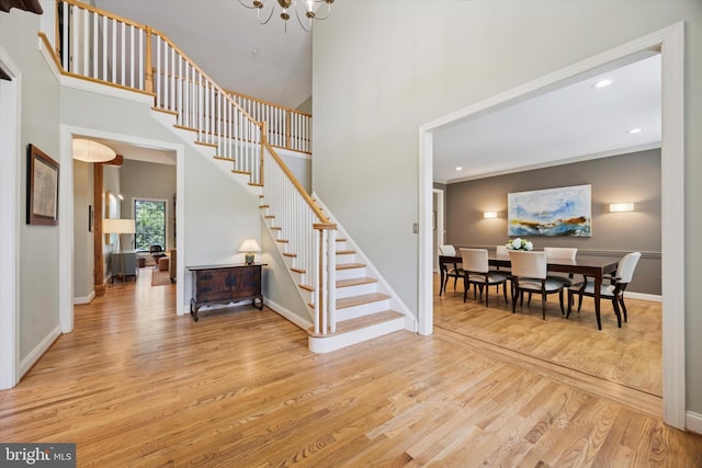 150 Waterview Dr, Glenmoore, PA 19343 - foyer entrance with stairs, light wood-style flooring, a chandelier, recessed lighting, and a towering ceiling