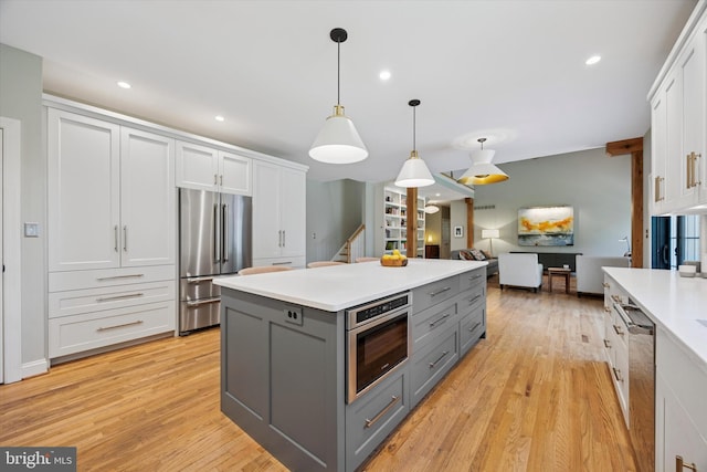150 Waterview Dr, Glenmoore, PA 19343 - kitchen with gray cabinetry, appliances with stainless steel finishes, light wood finished floors, light countertops, and recessed lighting