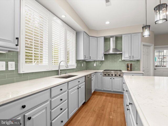 6720 Walter Scott Way, Columbia, MD 21044 - kitchen featuring wall chimney exhaust hood, appliances with stainless steel finishes, light wood-type flooring, decorative backsplash, and recessed lighting