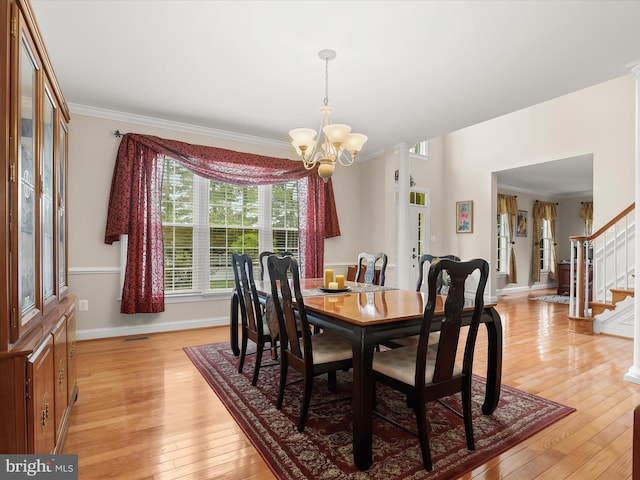 6720 Walter Scott Way, Columbia, MD 21044 - dining area featuring a chandelier, light wood-type flooring, stairway, and ornamental molding