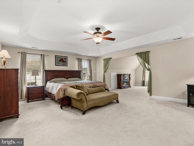 6720 Walter Scott Way, Columbia, MD 21044 - bedroom featuring a tray ceiling, light carpet, and ceiling fan