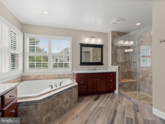 6720 Walter Scott Way, Columbia, MD 21044 - bathroom with vanity, a bath, a shower stall, recessed lighting, and wood finished floors