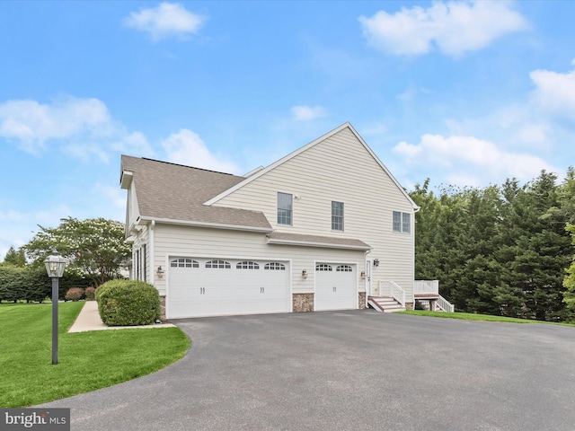 6720 Walter Scott Way, Columbia, MD 21044 - view of property exterior with asphalt driveway, a shingled roof, a garage, stone siding, and a yard
