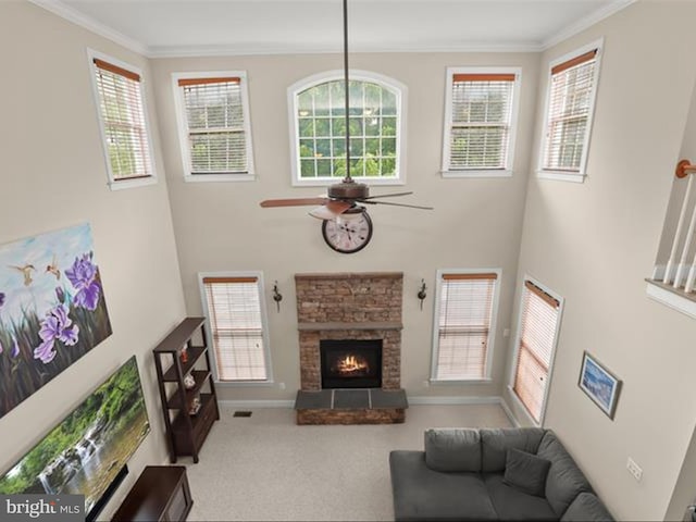 6720 Walter Scott Way, Columbia, MD 21044 - carpeted living area with crown molding, ceiling fan, a fireplace, healthy amount of natural light, and a high ceiling
