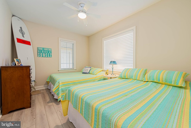 301 14th St Unit 304, Ocean City, MD 21842 - bedroom with light wood finished floors and a ceiling fan