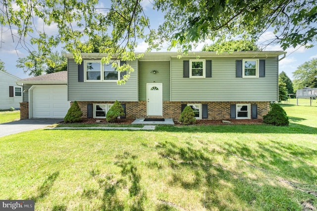 2110 Douglas Dr, Carlisle, PA 17013 - raised ranch with an attached garage, asphalt driveway, and a front yard