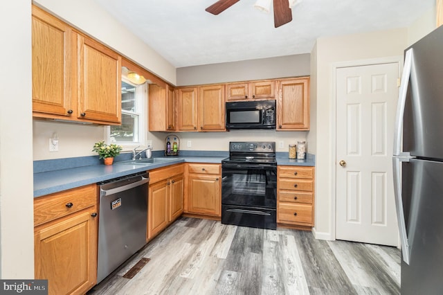 2110 Douglas Dr, Carlisle, PA 17013 - kitchen featuring black appliances, light wood-type flooring, and a ceiling fan