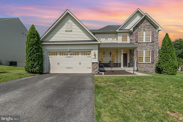 10535 Windlass Run Rd, Baltimore, MD 21220 - view of front of property with stone siding, a porch, driveway, and a yard