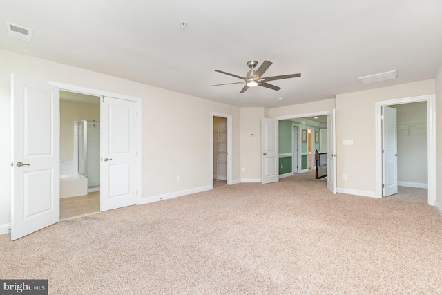 10535 Windlass Run Rd, Baltimore, MD 21220 - unfurnished bedroom featuring a walk in closet, a closet, light colored carpet, and ensuite bathroom