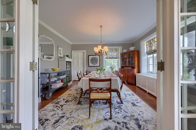 152 Main St, New Providence, PA 17560 - dining area with radiator, dark wood-type flooring, ornamental molding, and a chandelier