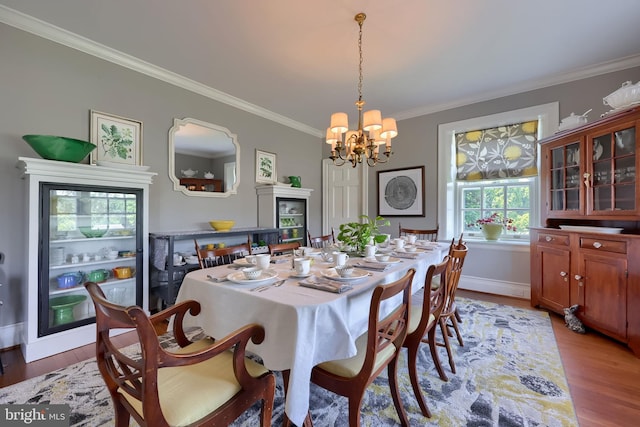 152 Main St, New Providence, PA 17560 - dining area with a chandelier, light wood-type flooring, and crown molding