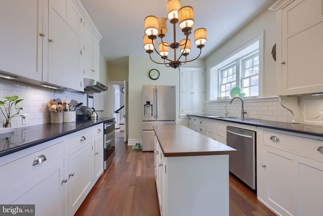 152 Main St, New Providence, PA 17560 - kitchen featuring appliances with stainless steel finishes, dark countertops, and tasteful backsplash