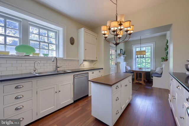 152 Main St, New Providence, PA 17560 - kitchen with dark countertops, stainless steel dishwasher, a chandelier, and a center island
