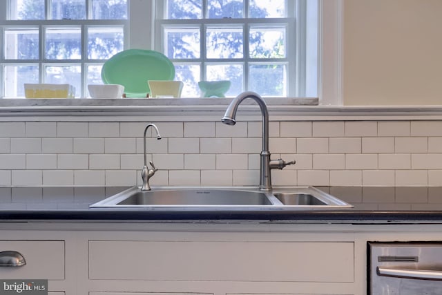 152 Main St, New Providence, PA 17560 - kitchen featuring white cabinetry, tasteful backsplash, and dark countertops
