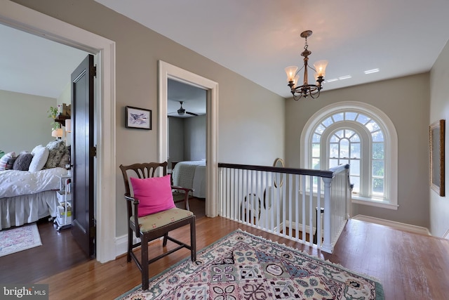 152 Main St, New Providence, PA 17560 - hall featuring wood finished floors, a chandelier, and an upstairs landing