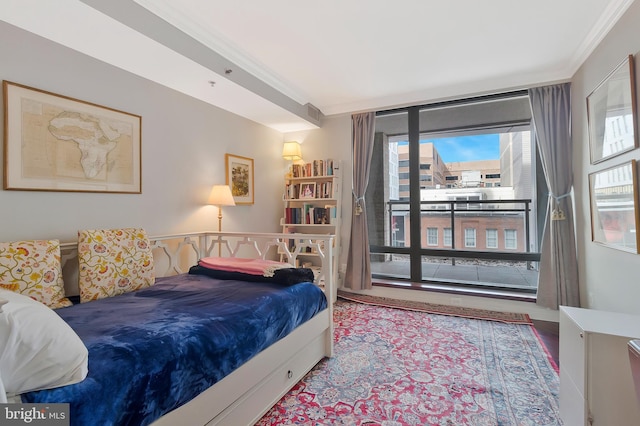 1155 23rd St NW Unit 5L, Washington, DC 20037 - bedroom featuring access to exterior, ornamental molding, and wood finished floors