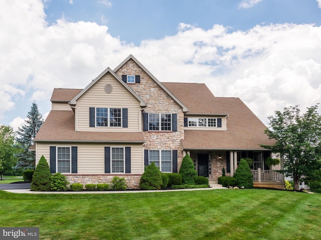 488 Hopewell Rd, Downingtown, PA 19335 - craftsman-style house featuring stone siding, a front yard, covered porch, and a shingled roof