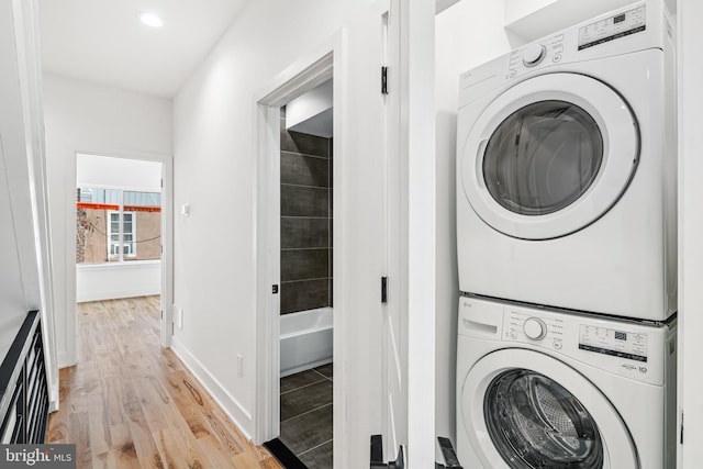 3084 Weikel St, Philadelphia, PA 19134 - laundry room featuring stacked washer / drying machine, light wood-style floors, and recessed lighting