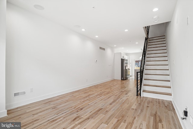 3084 Weikel St, Philadelphia, PA 19134 - unfurnished living room featuring light wood finished floors, recessed lighting, and stairs
