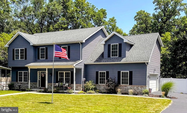 145 Pleasant View Ter, New Cumberland, PA 17070 - view of front of property with stone siding, a porch, a garage, and a shingled roof