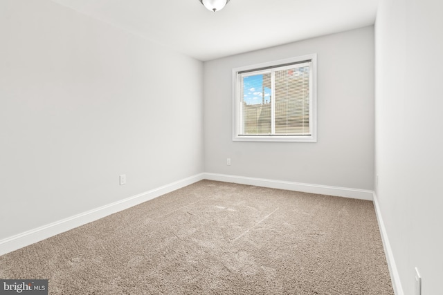 233 S Clinton St, Baltimore, MD 21224 - carpeted empty room with baseboards