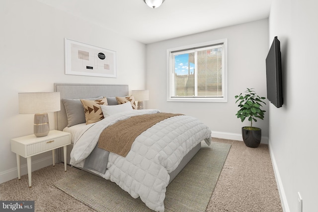 233 S Clinton St, Baltimore, MD 21224 - carpeted bedroom featuring baseboards