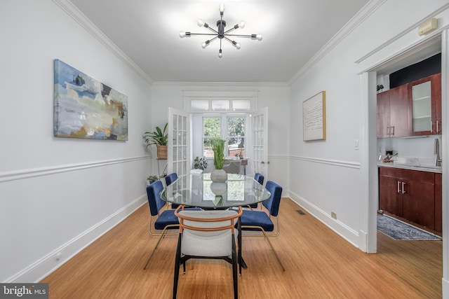 1217 Holbrook St NE, Washington, DC 20002 - dining area with light wood-style floors, crown molding, and french doors