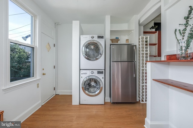 1217 Holbrook St NE, Washington, DC 20002 - laundry room with estacked washer and dryer and light wood-style flooring