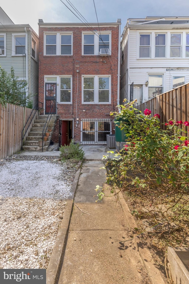 1217 Holbrook St NE, Washington, DC 20002 - rear view of property featuring brick siding and a fenced backyard