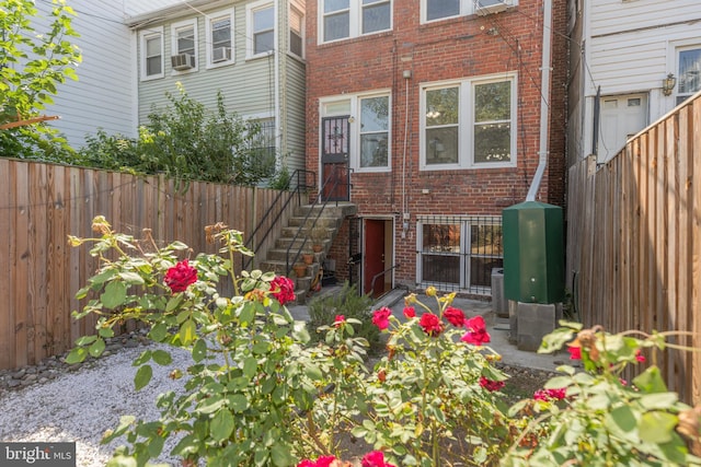 1217 Holbrook St NE, Washington, DC 20002 - rear view of property with brick siding, a fenced backyard, and cooling unit