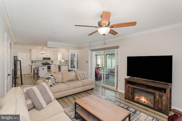 421 Dart Dr, Hanover, PA 17331 - living area featuring ornamental molding, light wood-style flooring, and ceiling fan