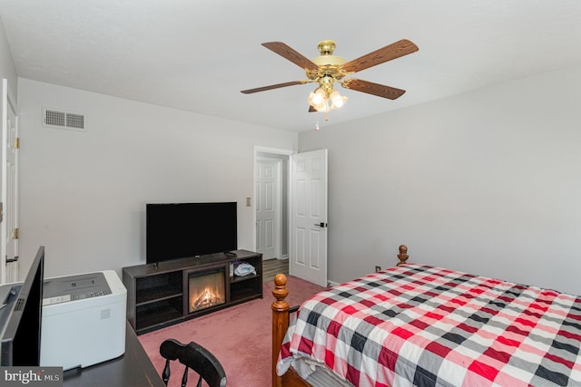 421 Dart Dr, Hanover, PA 17331 - bedroom featuring carpet, ceiling fan, and a warm lit fireplace