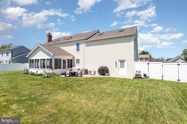 421 Dart Dr, Hanover, PA 17331 - rear view of house featuring a gate, a patio area, a sunroom, and a fenced backyard