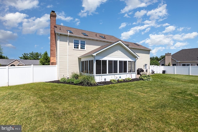 421 Dart Dr, Hanover, PA 17331 - back of house with a sunroom, a chimney, and a fenced backyard