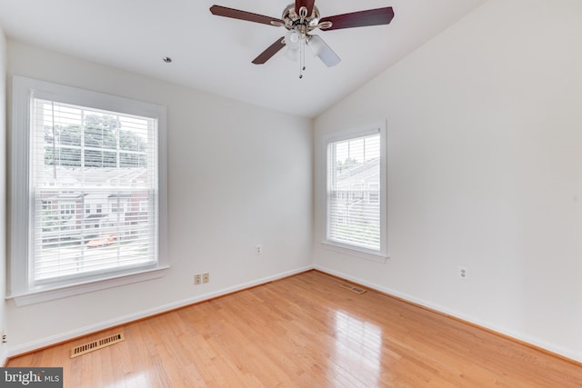 11710 Scooter Ln Unit 7, Fairfax, VA 22030 - empty room featuring plenty of natural light, wood finished floors, lofted ceiling, and ceiling fan