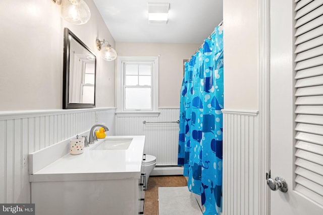 14 Birchall Dr, Haddonfield, NJ 08033 - full bath featuring wainscoting, vanity, a baseboard heating unit, radiator heating unit, and a shower with shower curtain