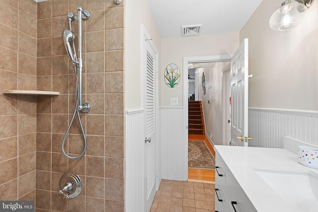 14 Birchall Dr, Haddonfield, NJ 08033 - bathroom featuring a wainscoted wall, a tile shower, vanity, a closet, and tile patterned flooring