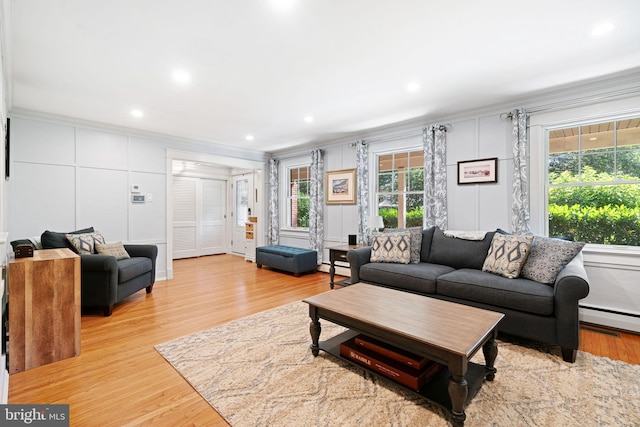 14 Birchall Dr, Haddonfield, NJ 08033 - living room featuring crown molding, a decorative wall, light wood-type flooring, a baseboard heating unit, and a baseboard radiator