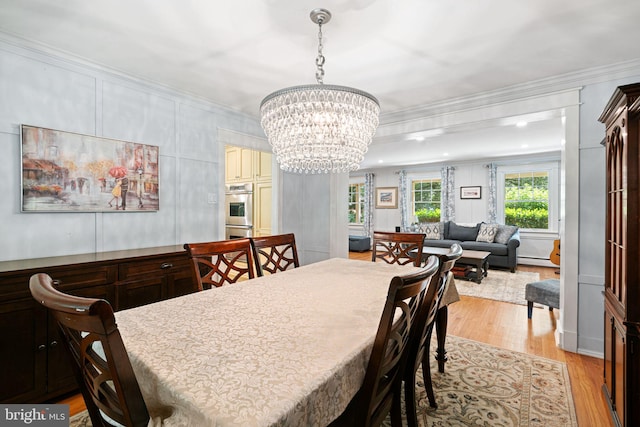 14 Birchall Dr, Haddonfield, NJ 08033 - dining room with light wood-style flooring, ornamental molding, a chandelier, and baseboard heating